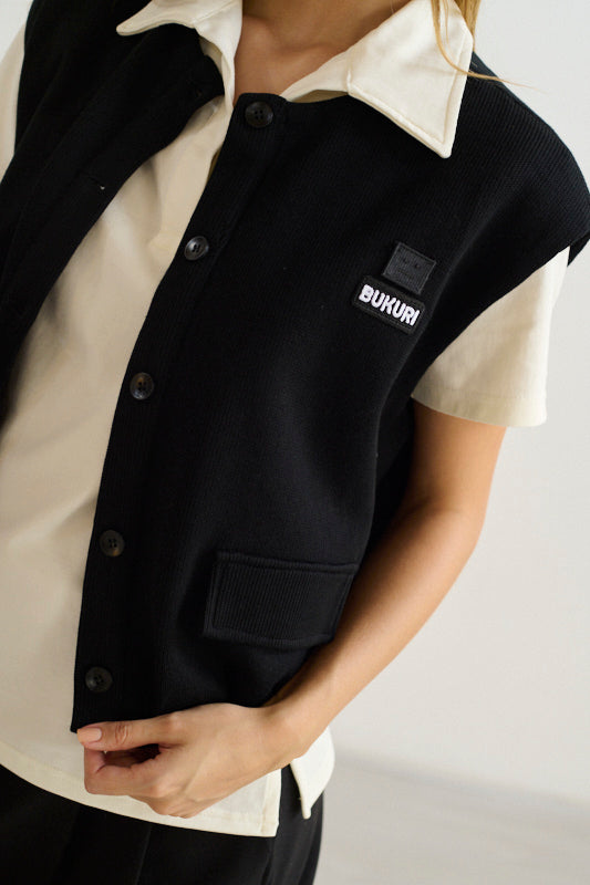 Chaleco negro tipo bomber